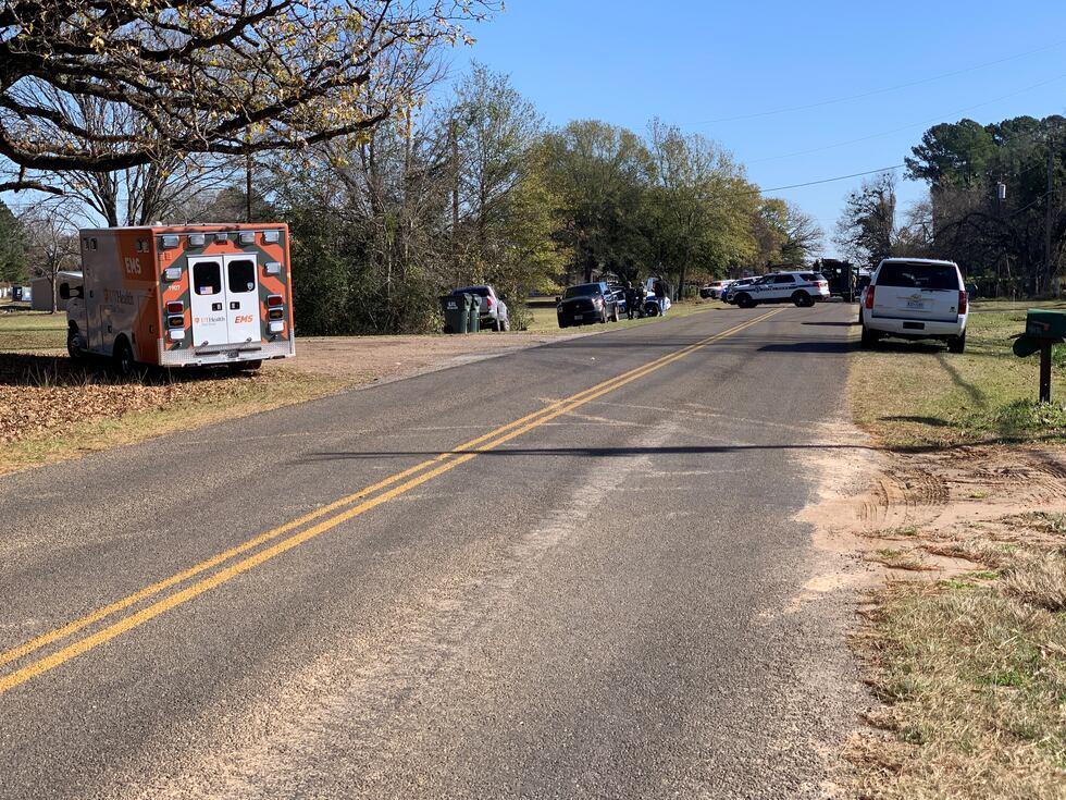 Several law enforcement officers surrounded the home along Old Henderson Highway.
